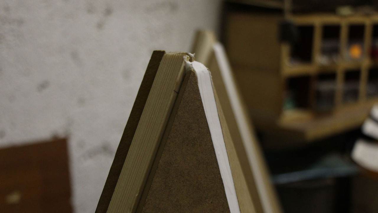 Wooden, unfinished tetrahedrons in workshop.